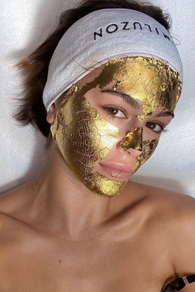 Kaia Gerber was photographed for Instagram after the application of the gold mask.