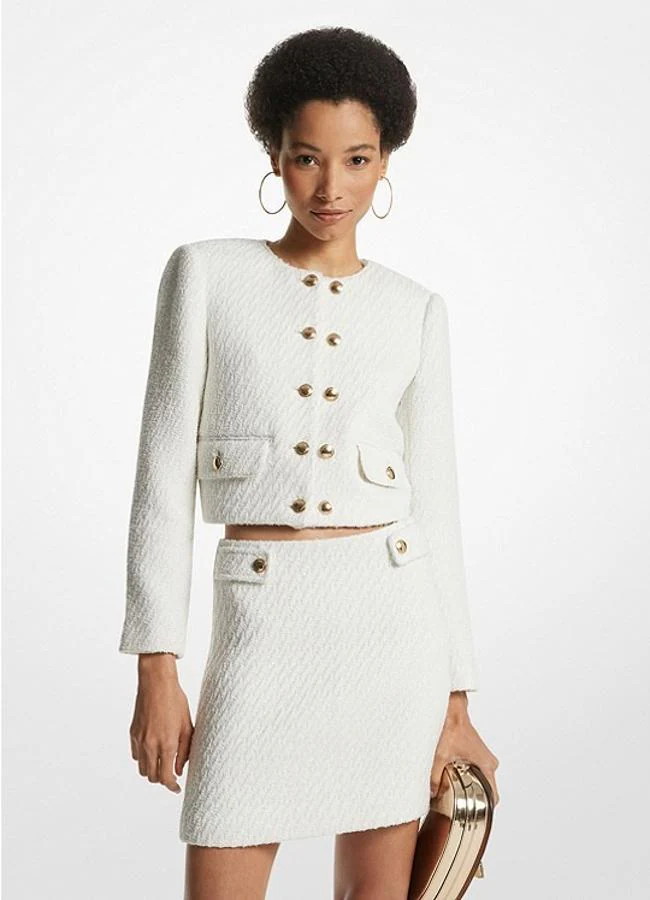 Traje de tweed blanco de Michel Kors, chaqueta 295 euros y falda 255 euros.