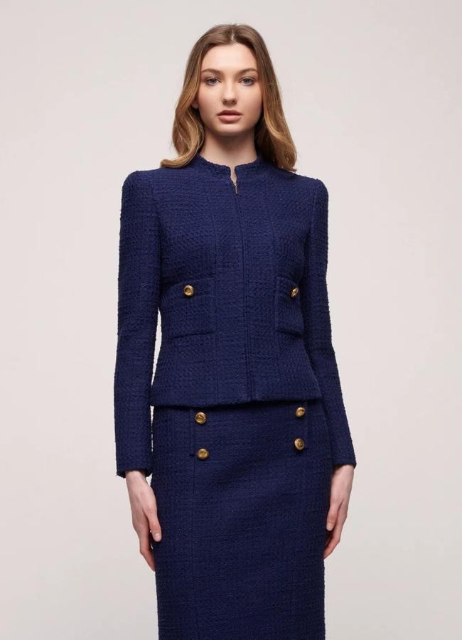 Traje de falda midi azul marino de Luisa Spagnoli, a la venta en Zalando: falda 234 euros y chaqueta 429 euros.